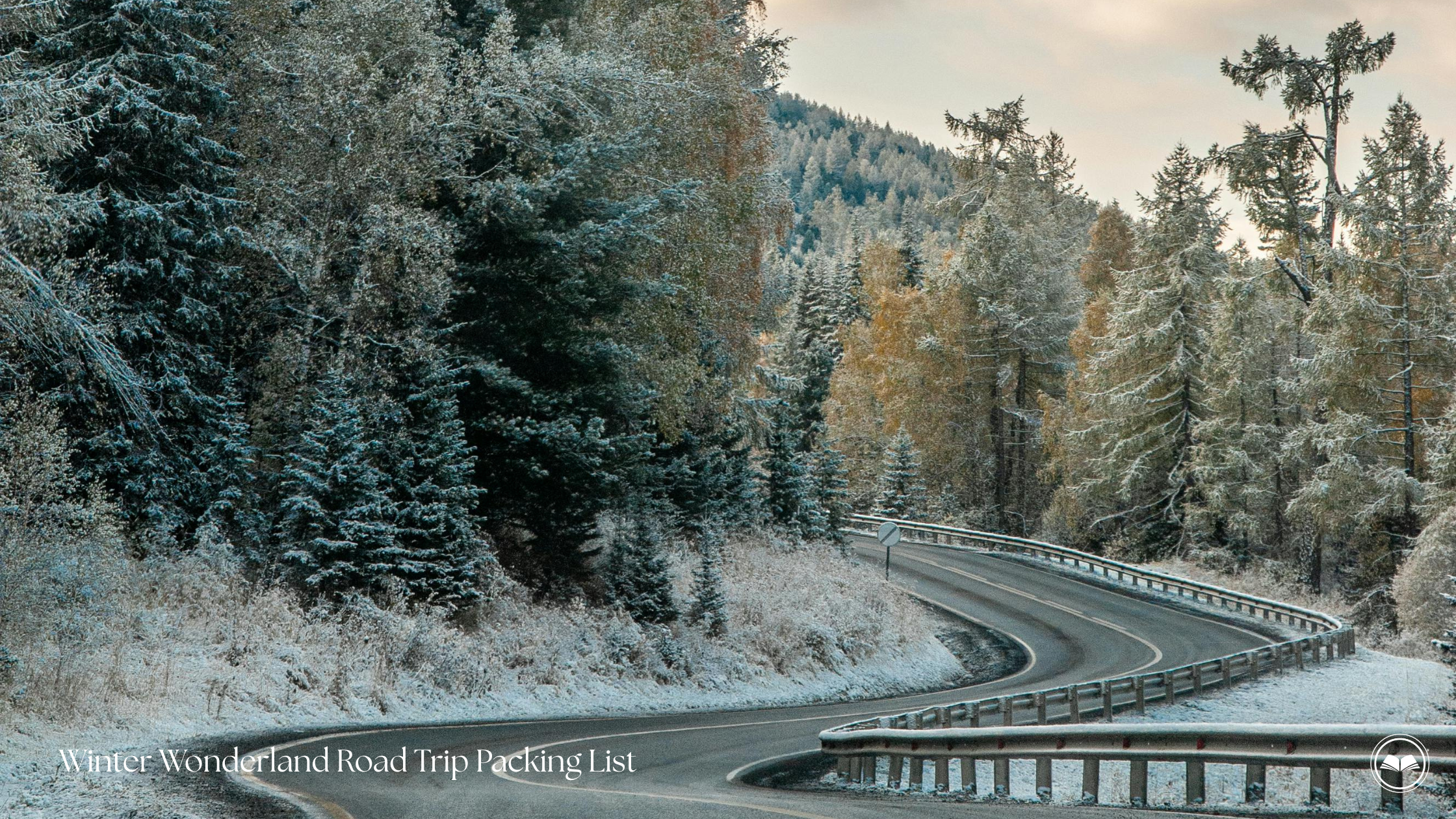 Curving snowy road lined with trees, perfect for a winter weekend road trip packing list inspiration.