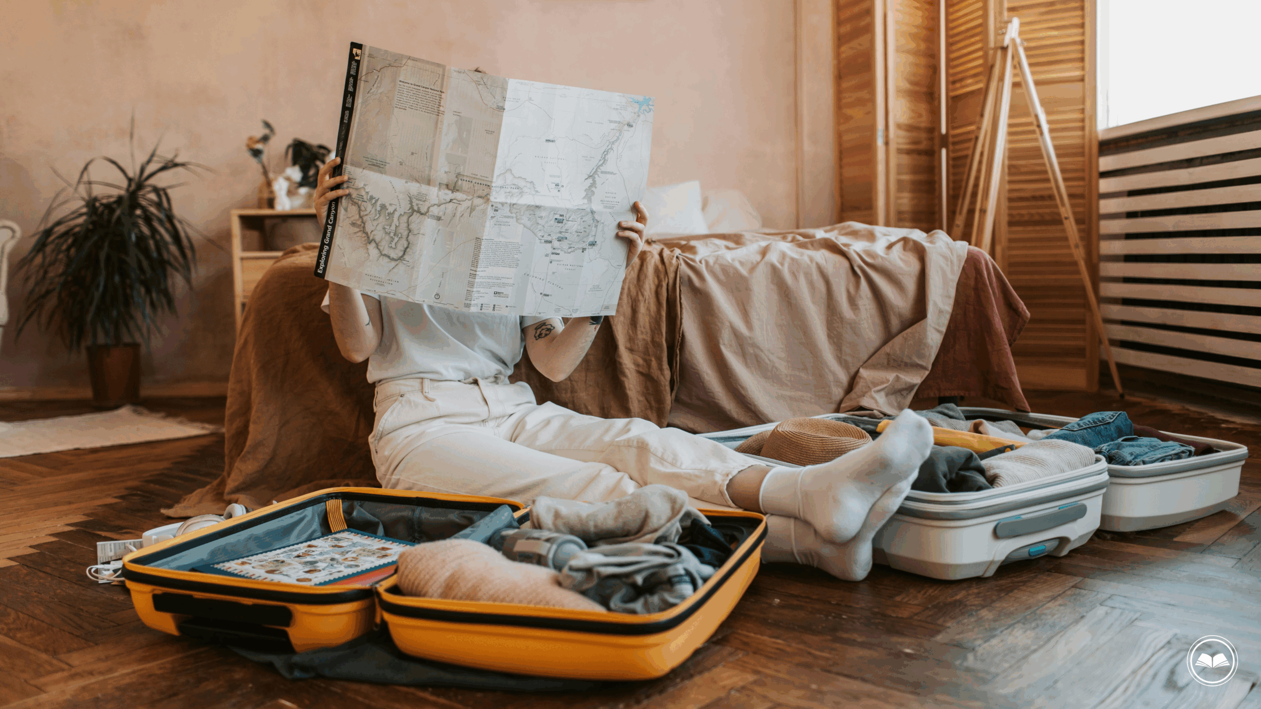 woman holding a map packing two suitcases and getting ready for a long-haul flight